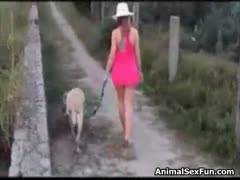 Lewd slut whacks off her dog's dick and gets her pussy screwed by the horny animal outdoors 